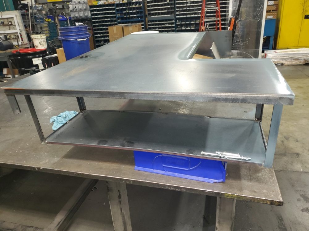 Stand up desk fabricated from steel