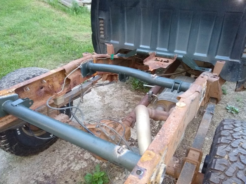 Truck crossmember replacement welded in place underneath a vehicle